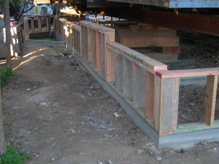 A wooden fence is being built.