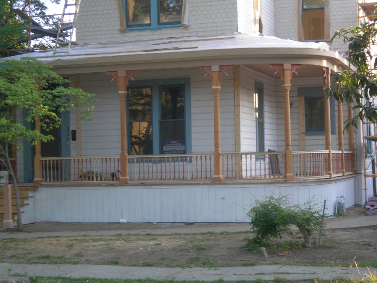 A white house with a porch.