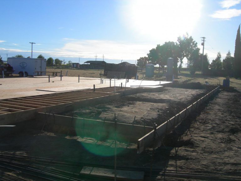 The sun is shining on the construction site.