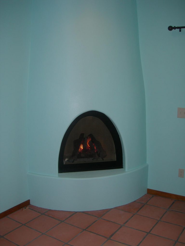A fireplace in a room.