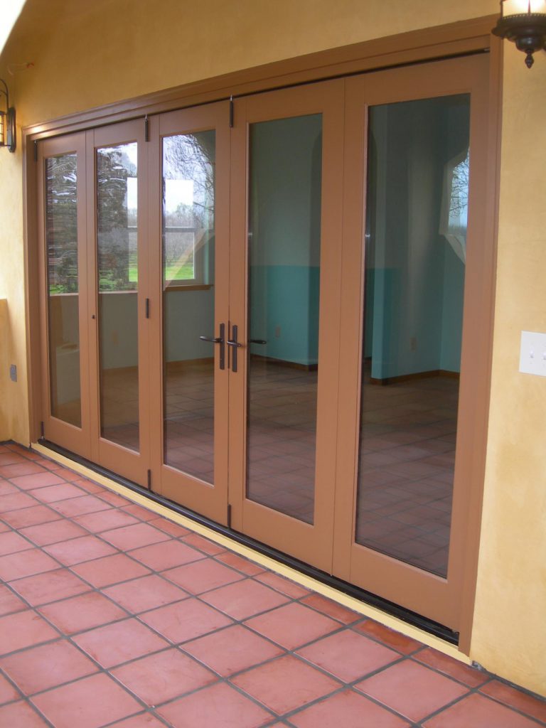 A patio with a brown tiled floor.