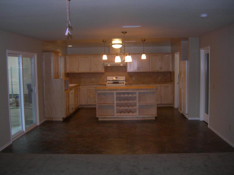 A kitchen with a counter top and cabinets.