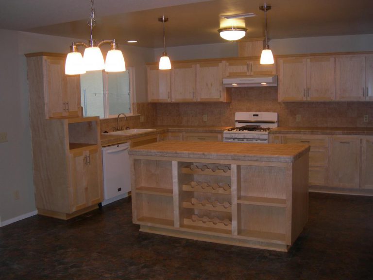A kitchen with a wine rack.