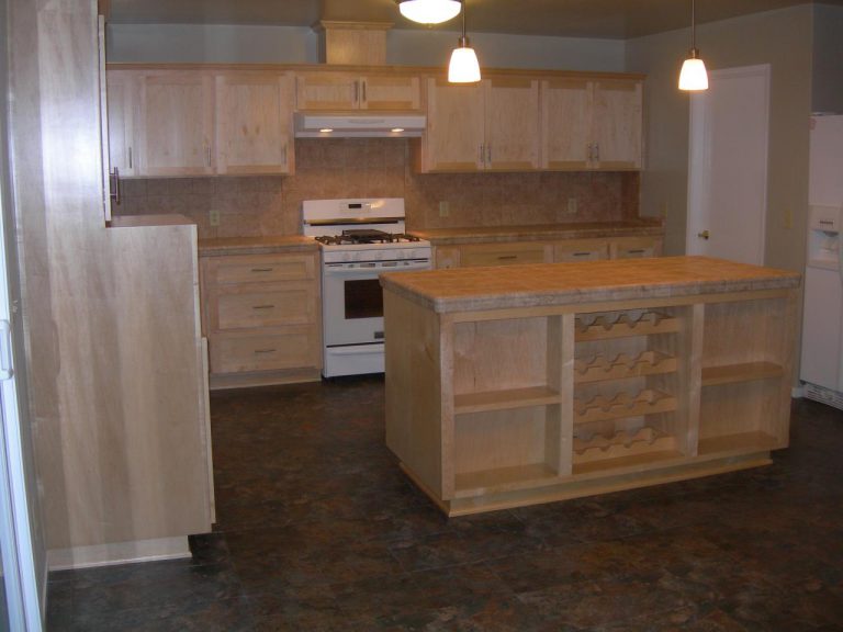 A kitchen with a wine rack.