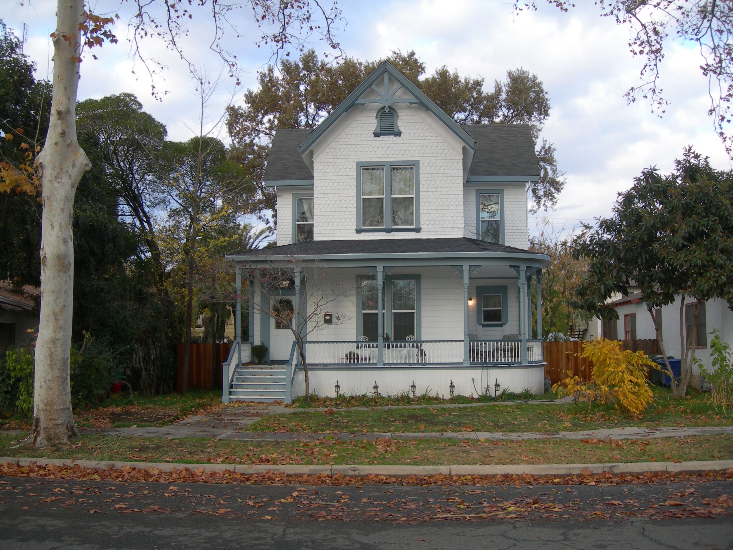 A white house with a porch.