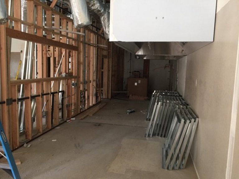 A room that is being remodeled with wooden beams.