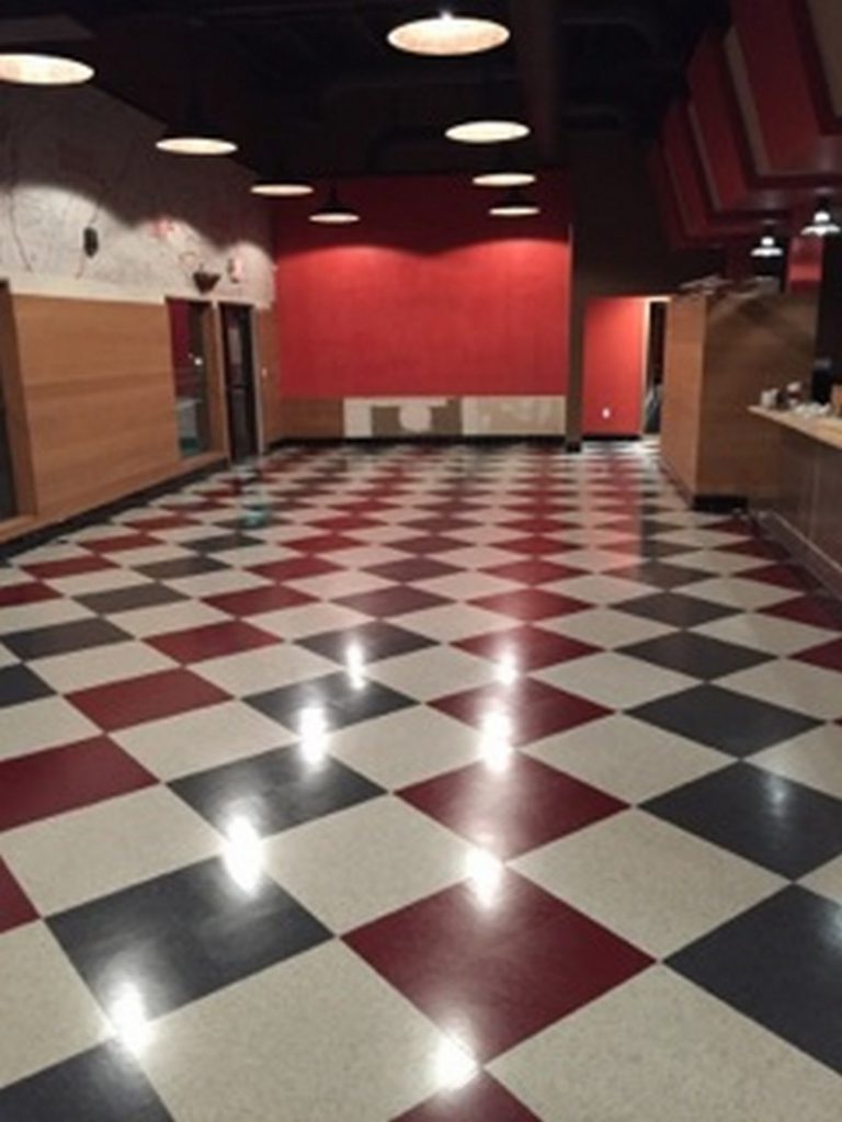 A red and black checkered floor in a room.