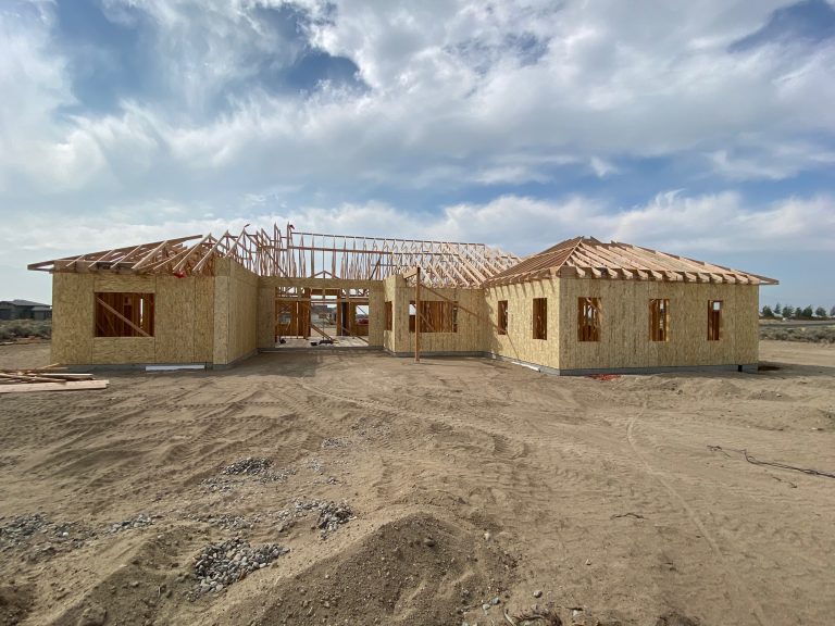 A house under construction in the desert.